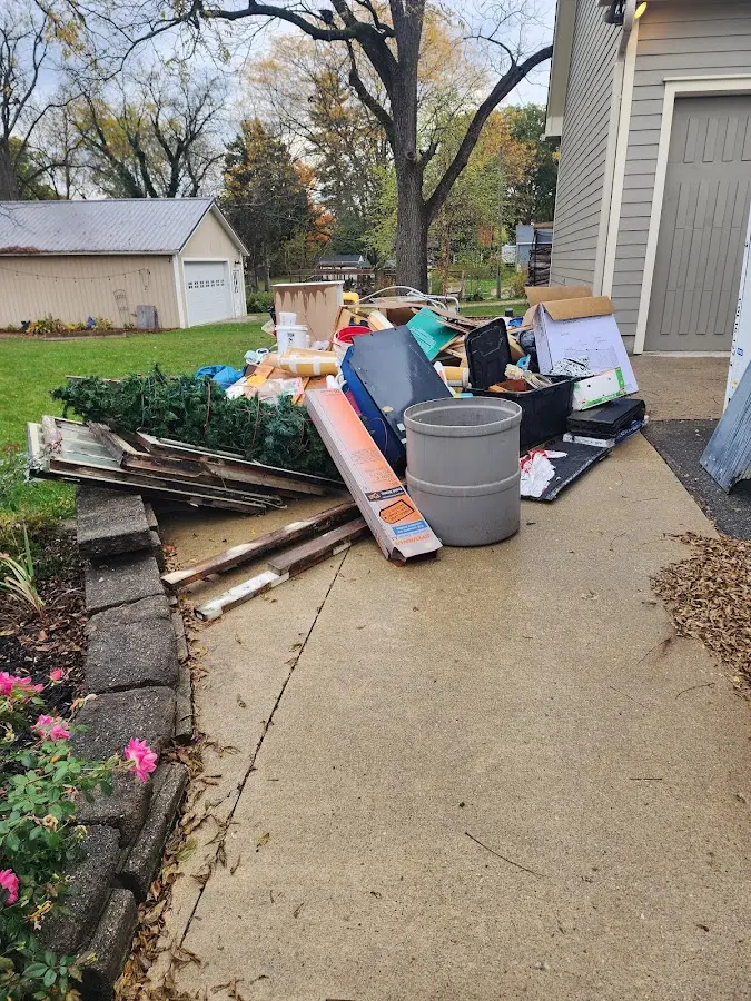 Dumpster being loaded with debris for Demolition Dumpster Rental in Fortville